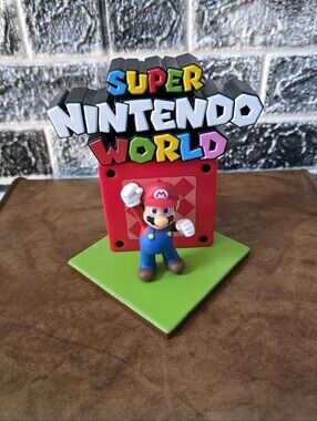 Nintendo Mario Figure with Colorful Super Nintendo World Sign Collectible